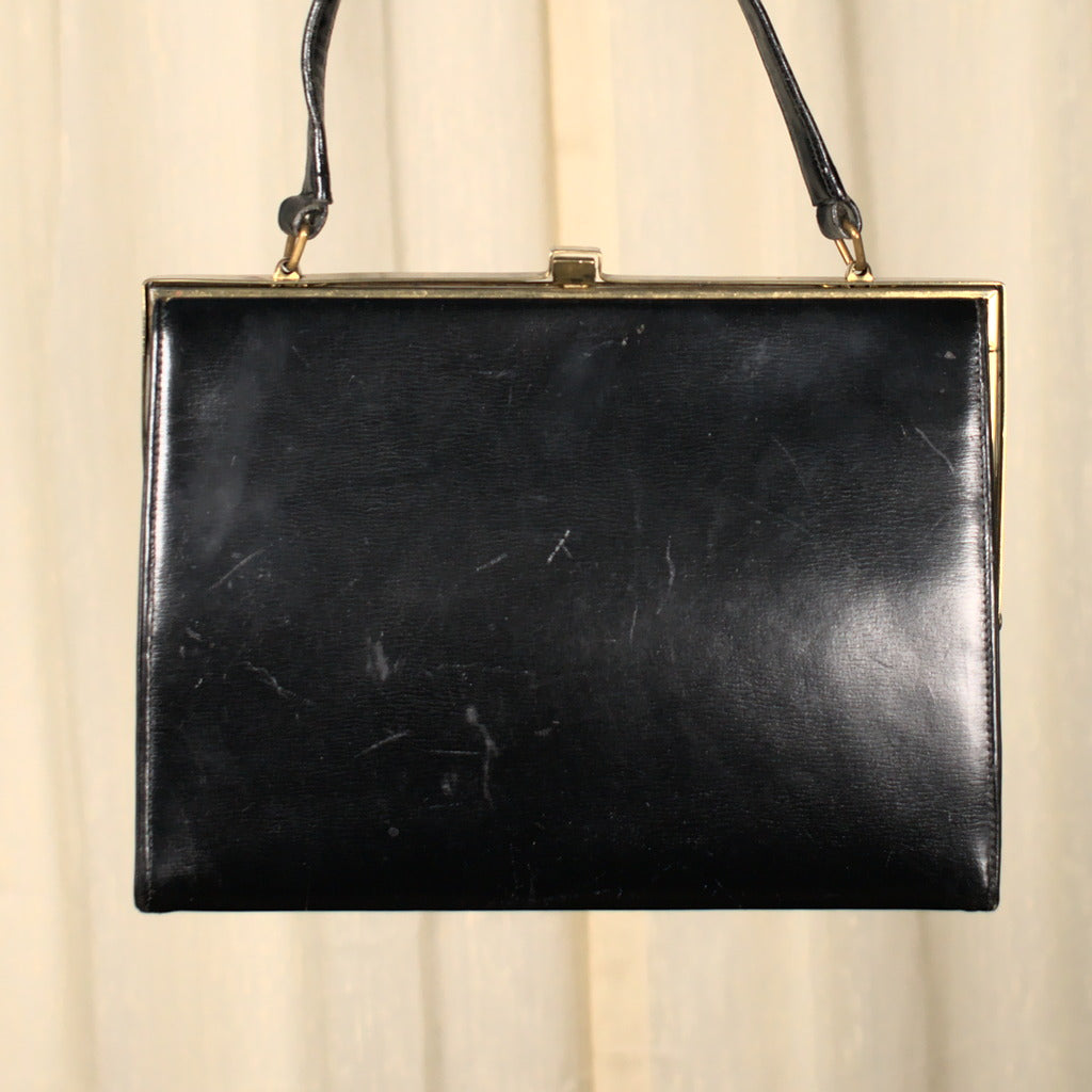 Vintage 1950s Peck & Peck fifth avenue New York black clutch with satin orders coin